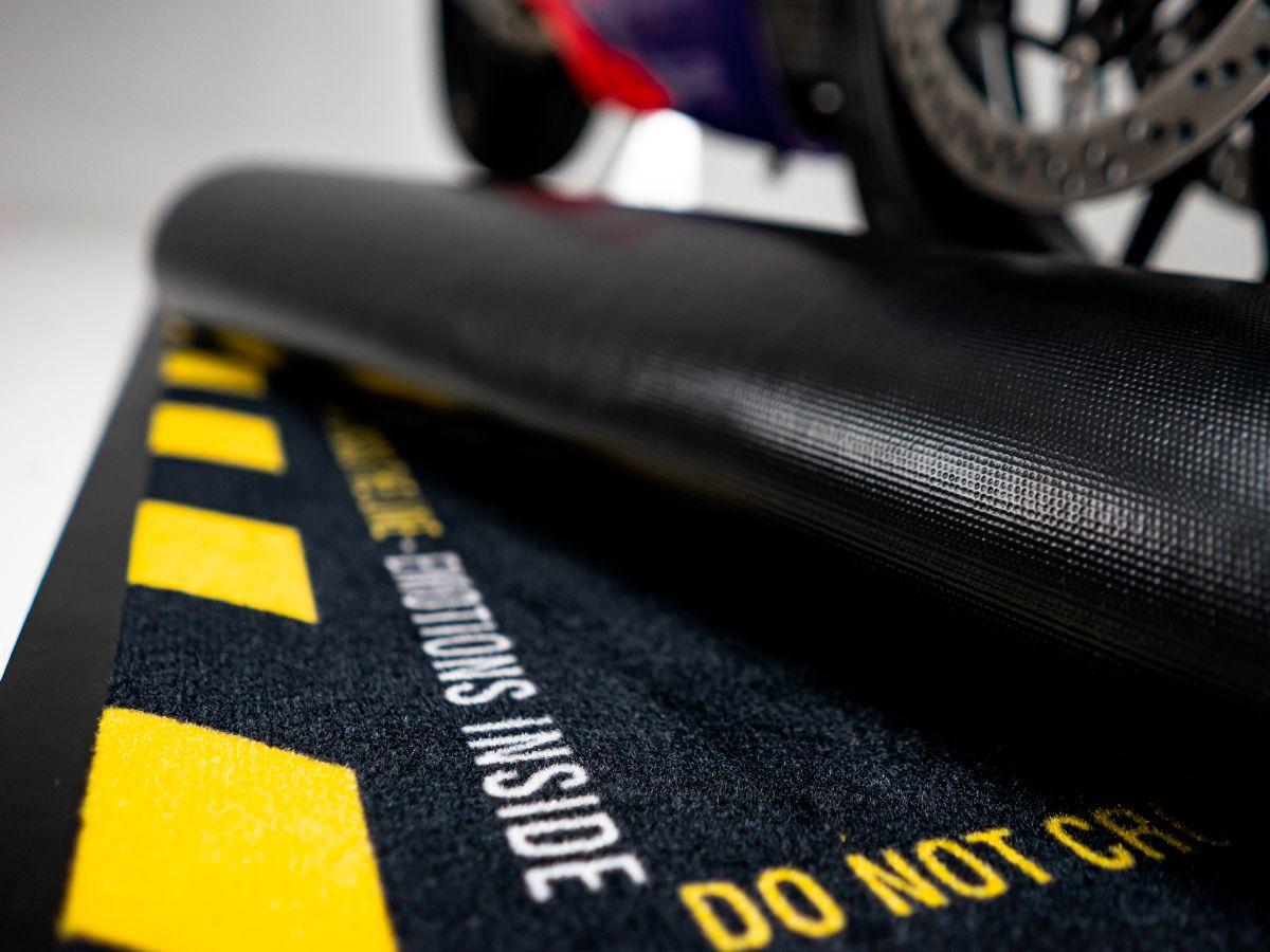 ORIGINAL WRS RECTANGULAR MOTORCYCLE CARPET WITH "CAUTION STRONG EMOTIONS" WORDS